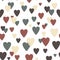 Romantic seamless pattern with multicolored hearts on a white background. Valentine`s Day.