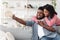 Romantic Selfie. Happy Loving Black Couple Capturing Photo On Smartphone At Home