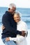 Romantic Senior Couple Hugging On Beach