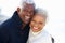 Romantic Senior Couple Hugging On Beach