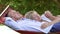 Romantic Senior Couple Relaxing In Garden Hammock Together