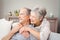 Romantic senior couple sitting in living room