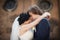 Romantic sensual husband and wife hugging in front of old church