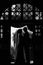 Romantic, sensual newlywed couple silhouettes hugging in doorway