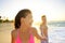 Romantic smiling young couple at beach in sunset