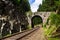 Romantic stone bridge over railway in beautiful forest, Czech republic