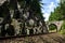 Romantic stone bridge over railway in beautiful forest, Czech republic