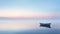 Romantic Sunrise: A Beautifully Minimalistic Boat Floating On A Serene Lake