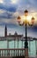 Romantic sunset views with ancient pink lantern on Grand Canal in front of the Basilika San Giorgio Maggiore in Venice, italy