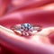 Romantic symbol diamond engagement ring on pink silk fabric Love