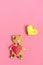 Romantic Teddy bear, gingerbread heart on trendy pink background.