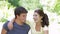 Romantic Teenage Couple Sitting In Garden Together