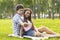 Romantic teenagers taking selfie on a date in park