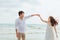 Romantic time loving couple dance on the beach. Love travel concept. Honeymoon concept