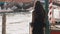 Romantic tourist woman on pier against beautiful view on venetian chanal in Venice, Italy.