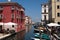 Romantic town of small Venice with old stone bridge and red building