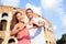 Romantic travel couple in Rome by Colosseum, Italy