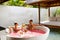 Romantic Vacation. Couple In Love Relaxing At Spa With Cocktails