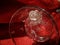 Romantic Valentine glass rose in clear water on absolute red background