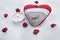 Romantic Valentine Plush Heart With A Winged Metal Heart On Ice Besides A Peaceful Tea Light Surrounded By Rose Bloom