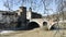 Romantic view of ancient Roman Fabricio bridge well preserved and pedestrian way to go to Tiberina Island on Tiber river in