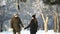 Romantic walk of a couple on a snow park in wonderful winter weather