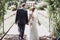 Romantic wedding moment, couple of newlyweds smiling portrait, bride and groom hug while on a walk in the park