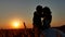 Romantic wedding young kiss couple silhouette. Loving couple at sunset nature man and girl silhouette