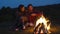 Romantic Weekend. Couple In Love Near Bonfire In Nature