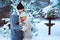 Romantic winter portrait of couple embracing outdoor on the walk in snowy forest