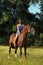 Romantic woman bareback riding in evening