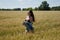 Romantic woman walking in golden fields of barley. sexy girl in field. summer holiday and vacation. Woman in wheat at the sun.