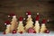Romantic wooden christmas background with red santa hats and cra