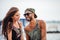 Romantic young beautiful couple in love laughing at the pier