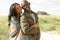 Romantic Young Couple Standing By Dunes