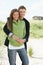 Romantic Young Couple Standing By Dunes