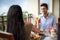 Romantic young couple at table toasting