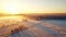 Romanticized Winter Sunrise: Aerial View Of Snowy Landscape In Rural Finland