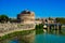 Rome, bridge of the angels, above the flowing Tiber, and Castel Sant'Angelo.