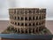 Rome Colosseum representation of the building on wooden table