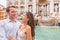 Rome couple on romantic date by Trevi Fountain in Roma, Italy. Romantic luxury honeymoon Europe cruise travel tourists