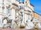 Rome - The fountain Fontana del Moro by Giacomo della Porta on Piazza on Navona and baroque Santa Agnese in Agone church.