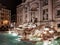 Rome, illuminated famous trevi fontain by night