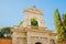 Rome, Italy - Angled view of the Farnese Gardens Horti Palatini during a clear sky afternoon and trees surrounding the area