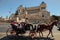 Rome, Italy - APRIL 11, 2017 : Tourist coach with horses in Piazza Venezia and Monumento Nazionale a Vittorio Emanuele II.