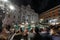 Rome, Italy - April 3, 2019: Tourists taking a pictures of the Trevi Fountain and makes selfie by night using a mobile devices