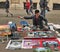 Rome, Italy - April 9, 2018 : Street artist - young man painting with spray pictures of Colosseum on pedestrian walk of Via delle
