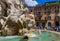 ROME, ITALY - AUGUST 11, 2016: Tourists walk by the fountain in Piazza Navona on August 11, 2016 in Rome Italy