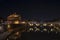 Rome Italy. Beautiful view of Castel Sant`Angelo and the bridge at night with reflections on the Tiber river