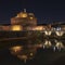 Rome Italy. Beautiful view of Castel Sant`Angelo and the bridge at night with reflections on the Tiber river